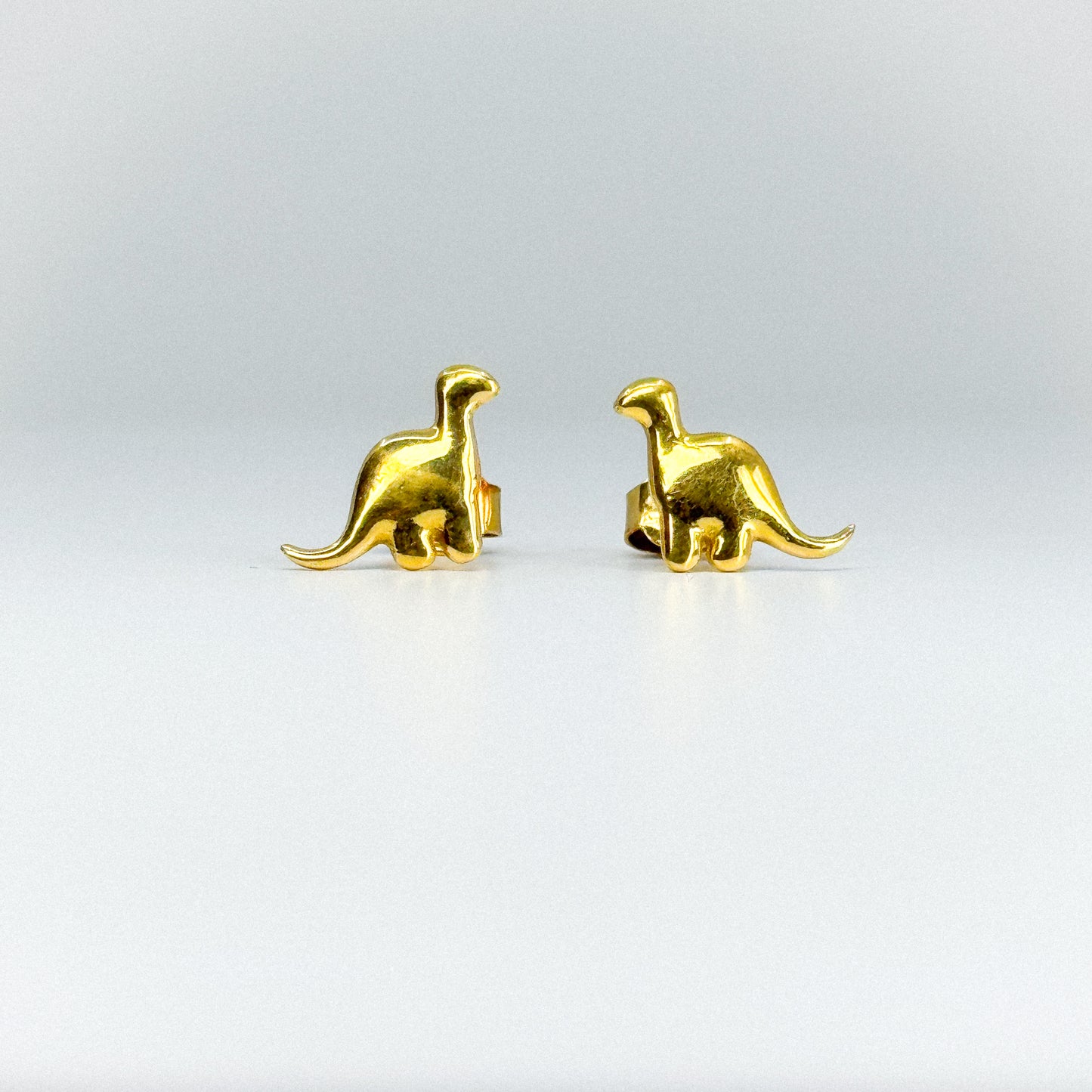 Aretes dinosaurio en oro 18k