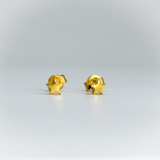 Aretes estrella en oro 18k