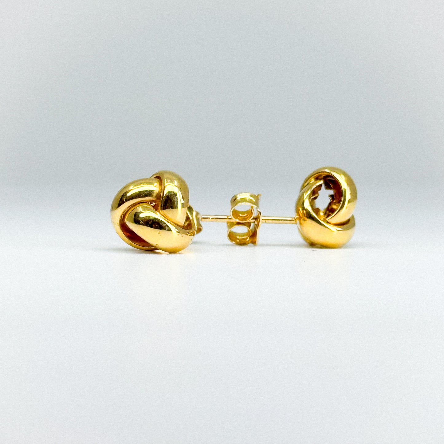 Aretes Triniti en oro 18k