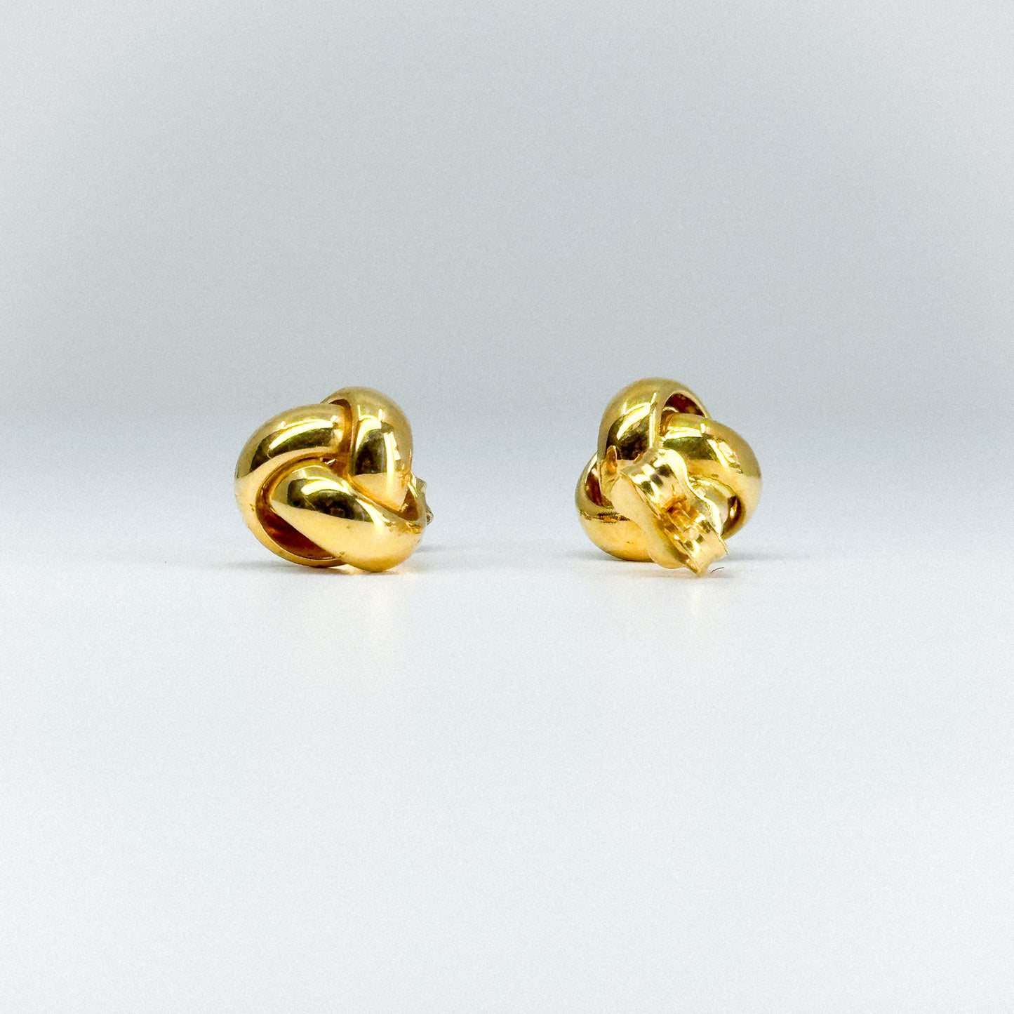 Aretes Triniti en oro 18k