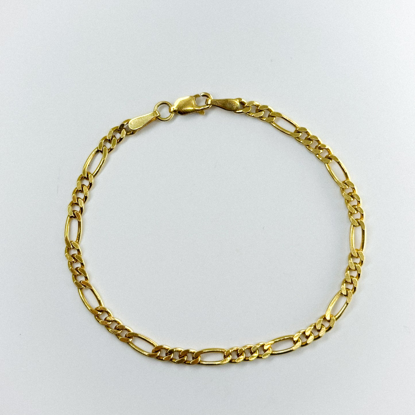Pulsera Fígaro en oro 18k